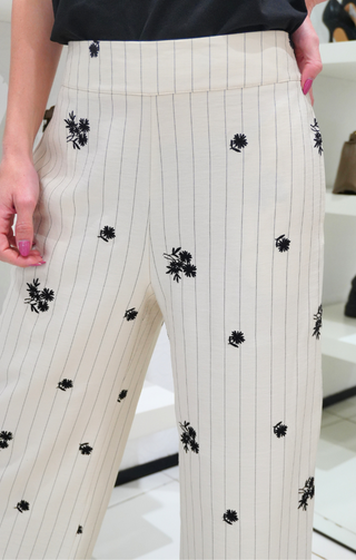 Pantalone con fantasia floreale panna