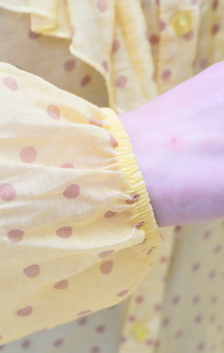 Blusa con volant e pois giallo