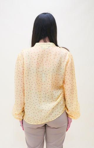 Blusa con volant e pois giallo